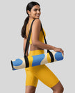 Model carrying yoga mat on shoulder strap