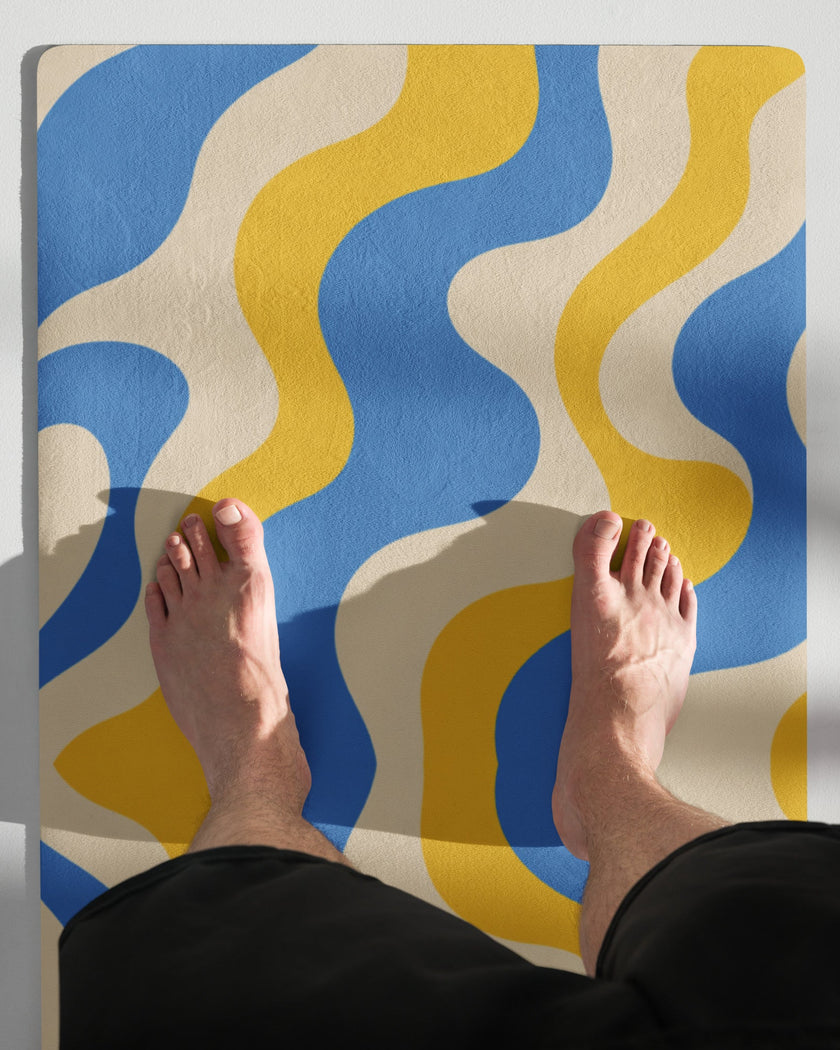 Model feet standing on cerulean swirl yoga mat