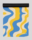 Cerulean swirl yoga mat half rolled flatlay vertical view