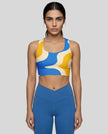 Athlesi model wearing cerulean swirl sports bra front view 