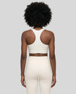 Athlesi model wearing cloud dancer sports bra back view