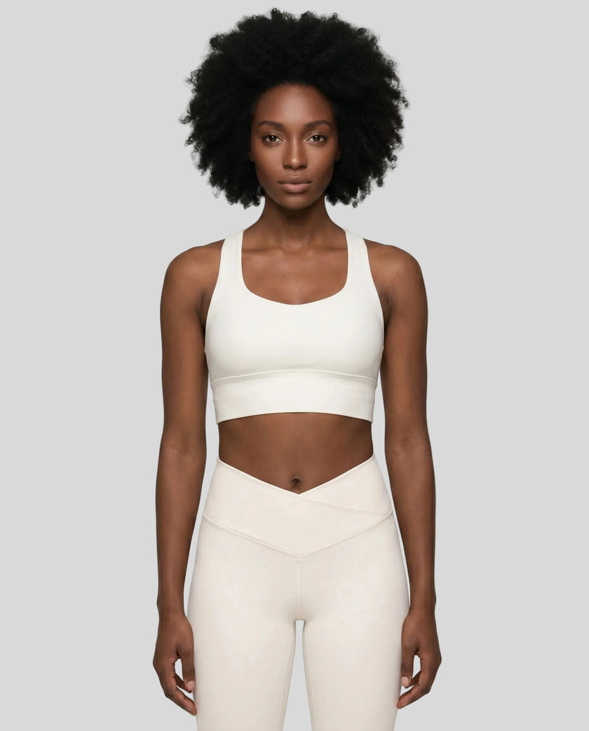 Athlesi model wearing cloud dancer sports bra front view
