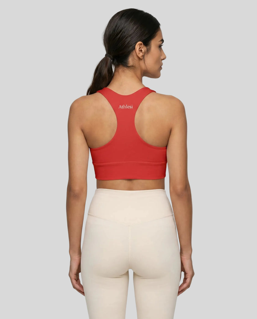 Athlesi model wearing tomato red sports bra back view