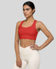 Athlesi model wearing tomato red sports bra left angle view