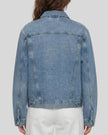 Back view of a model wearing the Heritage Denim Jacket in Blue