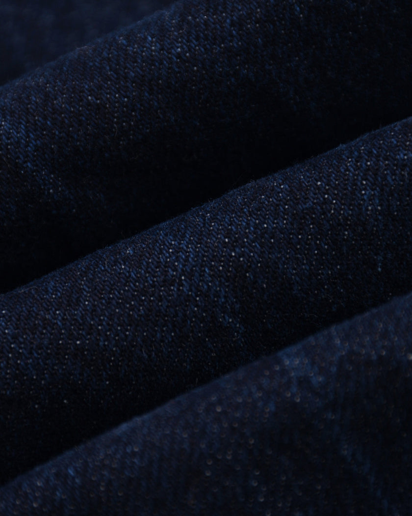 Close-up of the premium vintage washed denim fabric on the Heritage Denim Jacket in Navy Blue