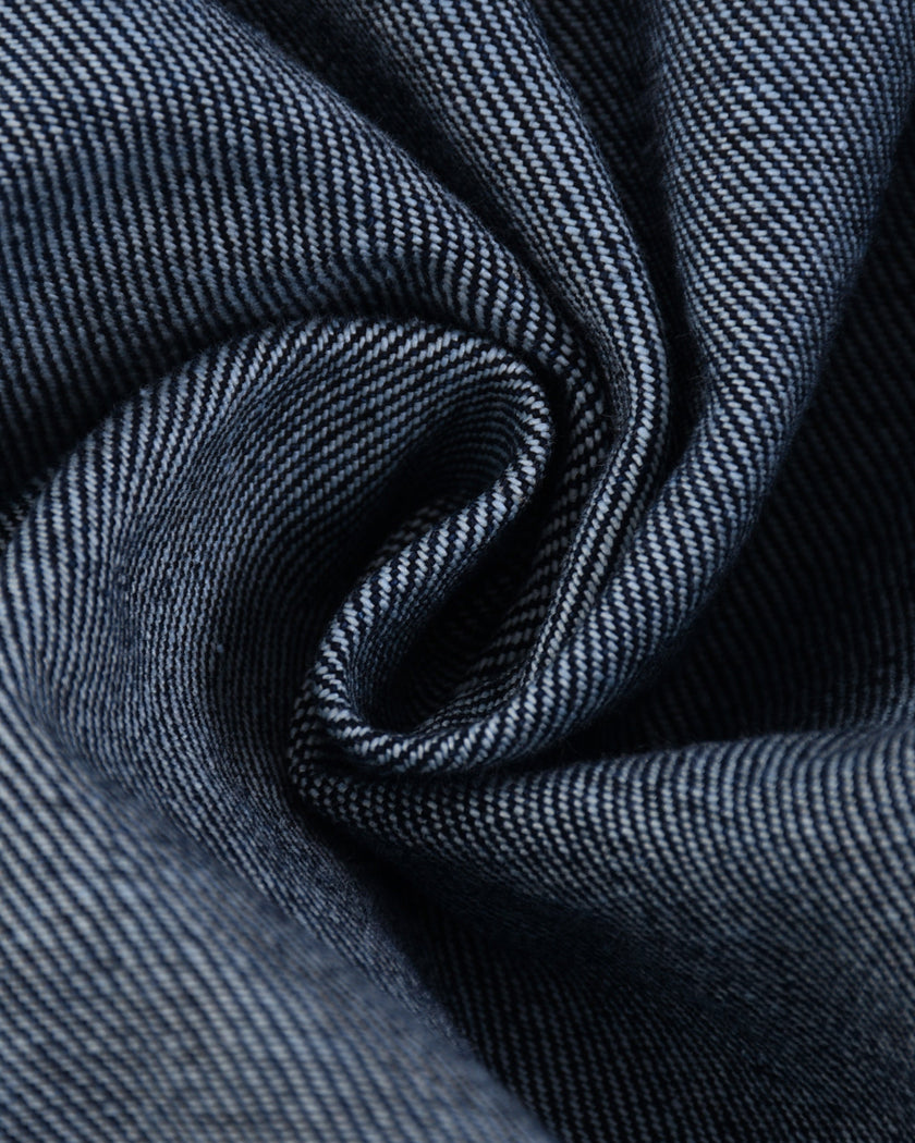 Detailed view of the denim texture and washed finish on the Heritage Denim Jacket in Navy Blue