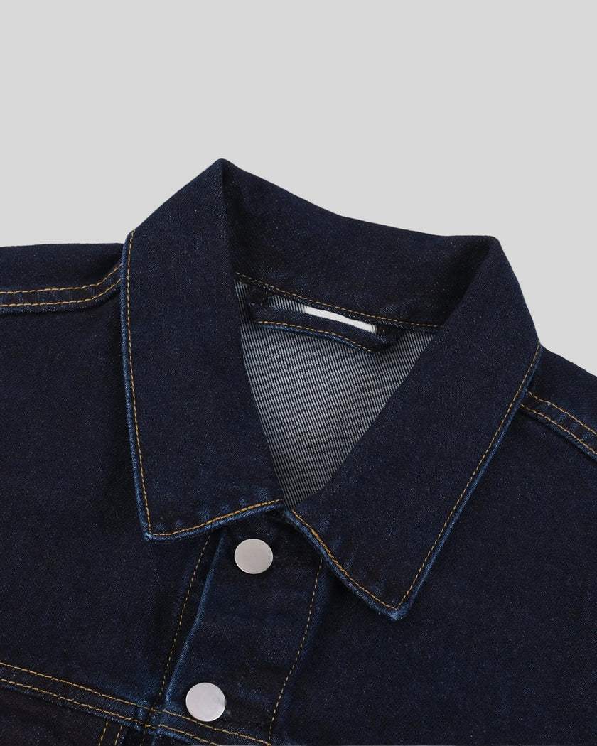 Close-up of the collar and button-front details on the Heritage Denim Jacket in Navy Blue