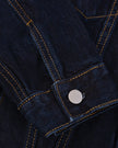 Close-up of the adjustable button cuff on the Heritage Denim Jacket in Navy Blue