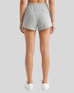 Back view of a model wearing the Heritage Lounge Shorts in Flower Gray