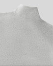 Close-up of a flower gray knit mock neck Athlesi Heritage Quarter-Zip Sweatshirt, showing the collar and textured fabric against a solid gray background.