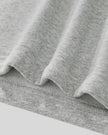 Close-up of Athlesi Heritage Quarter-Zip Sweatshirt in flower gray fabric with visible texture and hem stitching