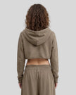 Back view of a model wearing the Heritage Washed Hoodie in Coffee