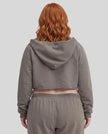 Back view of a model wearing the Heritage Washed Hoodie in Dark Gray