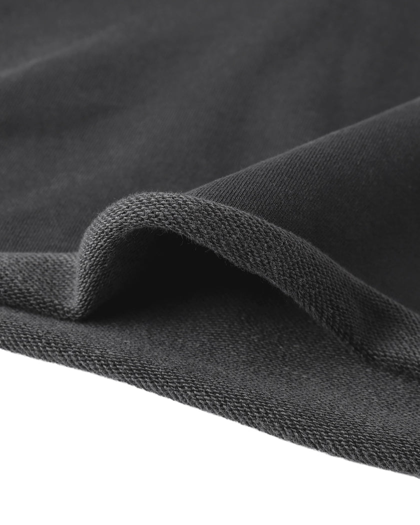 Close-up of the raw edge waist hem on the Heritage Washed Hoodie in Dark Gray