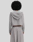 Back view of a model wearing the Heritage Washed Hoodie in Medium Gray