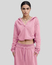 Model wearing the Heritage Washed Hoodie in Rose Pink viewed from the front