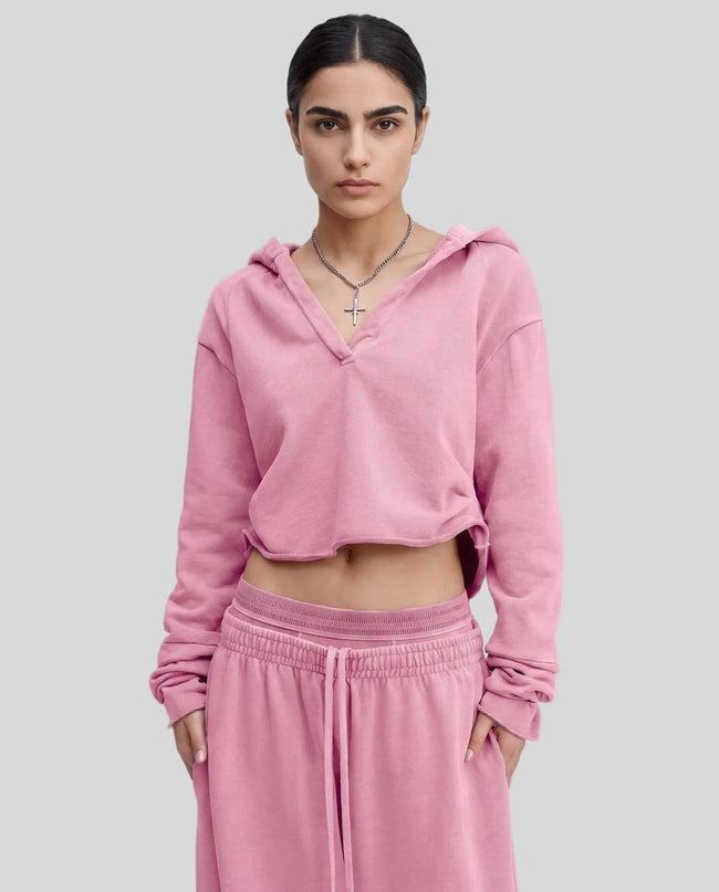 Model wearing the Heritage Washed Hoodie in Rose Pink viewed from the front
