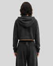Back view of a model wearing the Heritage Washed Hoodie in Washed Black