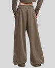 Back view of a model wearing the Heritage Washed Pants in Coffee