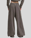 Back view of a model wearing the Heritage Washed Pants in Dark Gray