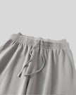Close-up of the double waistband and adjustable drawstring on the Heritage Washed Pants in Medium Gray