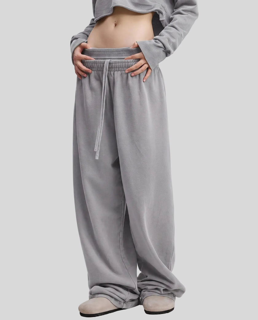 Front angled view of a model wearing the Heritage Washed Pants in Medium Gray