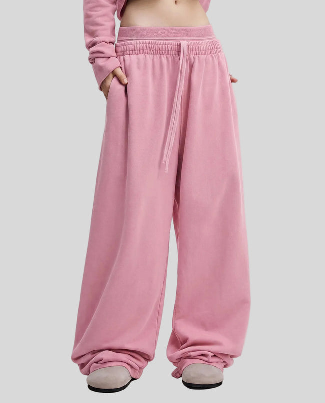 Model wearing the Heritage Washed Pants in Rose Pink viewed from the front