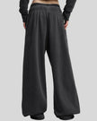 Back view of a model wearing the Heritage Washed Pants in Washed Black