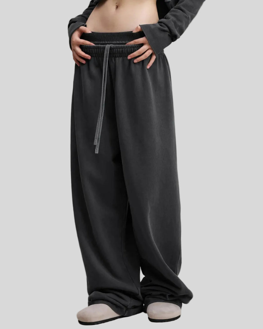 Front angled view of a model wearing the Heritage Washed Pants in Washed Black