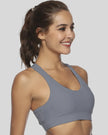 Supportive scoop-neck sports bra shown from right front angle in gray