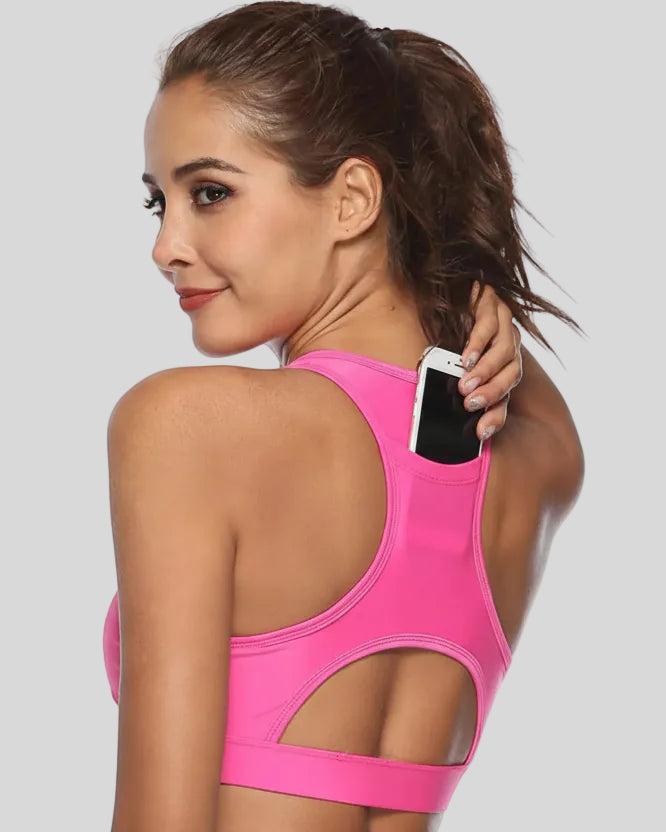 Back-cutout sports bra with integrated phone pocket shown in pink