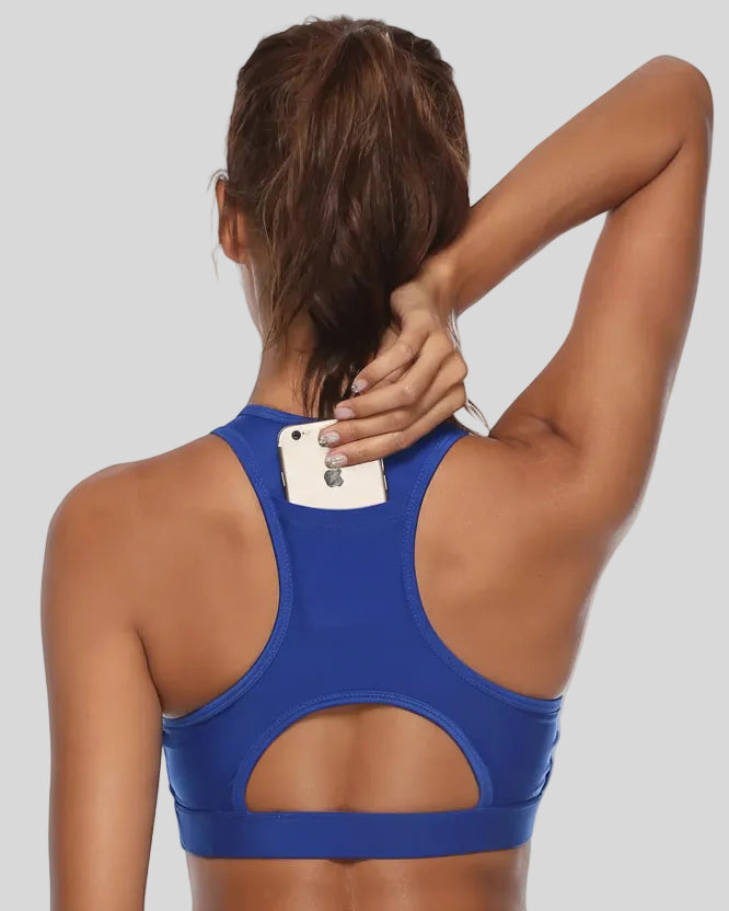 Back-cutout sports bra with integrated phone pocket shown in royal blue