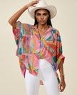 Front view of multicolor oversized button shirt with artistic retro-inspired print