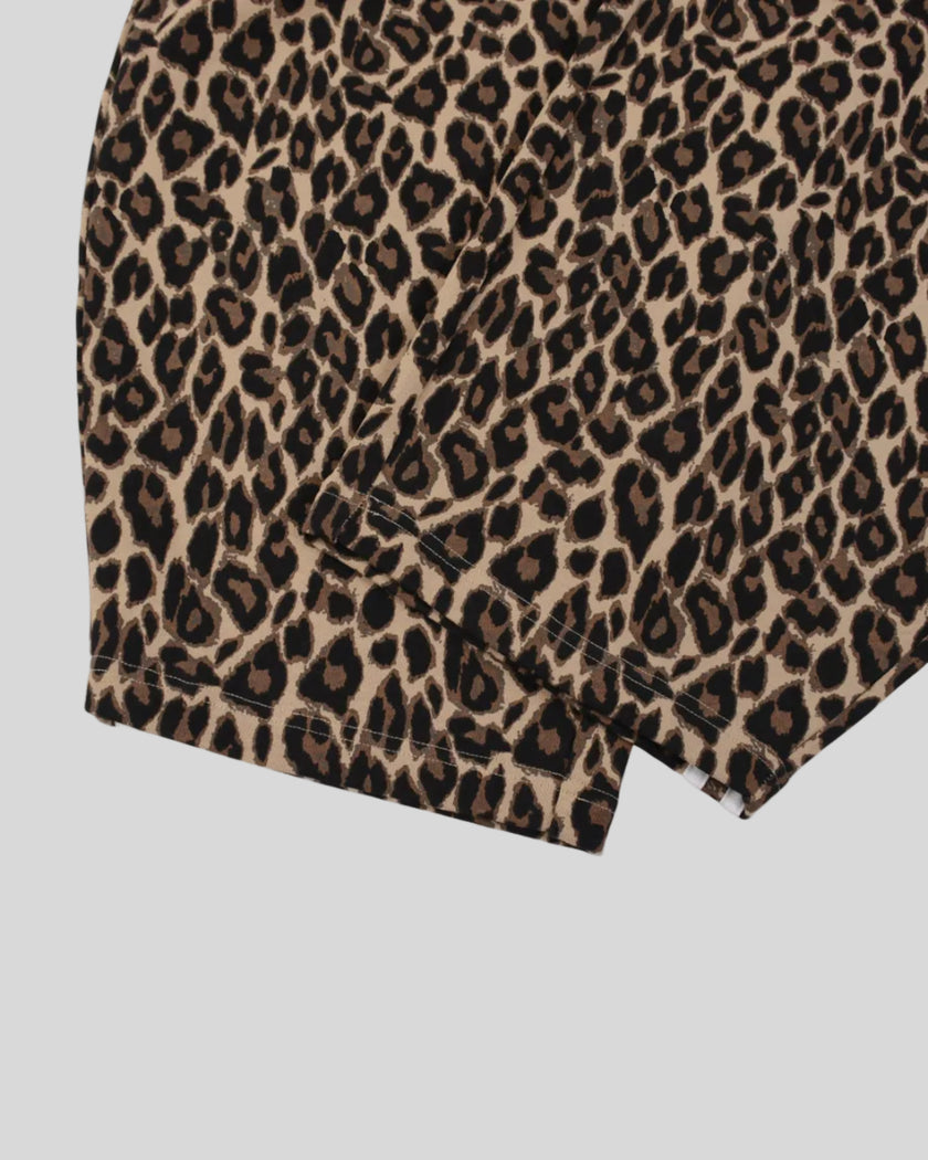 Closeup of barrel-leg hem and leopard print construction on Leopard Accent Barrel Pants