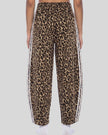 Lower body back view of woman wearing Leopard Accent Barrel Pants with contrast white side stripes