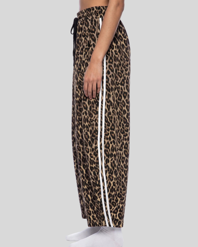 Lower body side view of woman wearing Leopard Accent Barrel Pants with contrast white side stripes