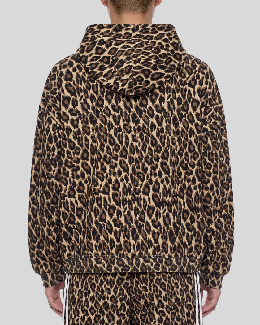 Upper body back view of woman wearing Leopard Accent Hoodie with oversized hood in Leopard Coffee