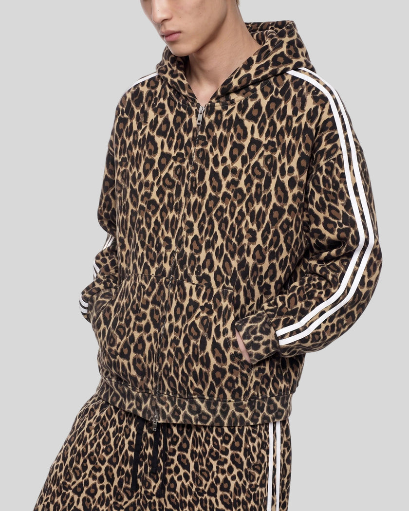 Upper body front angle view of woman wearing Leopard Accent Hoodie zipped closed in Leopard Coffee
