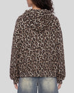 Upper body back view of woman wearing Leopard Accent Hoodie with oversized hood in Leopard Light Taupe