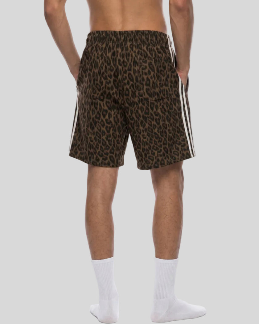 Lower body back angle view of woman wearing Leopard Accent Shorts with contrast white side stripes in Leopard Brown