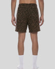 Lower body back view of woman wearing Leopard Accent Shorts with contrast white side stripes in Leopard Brown