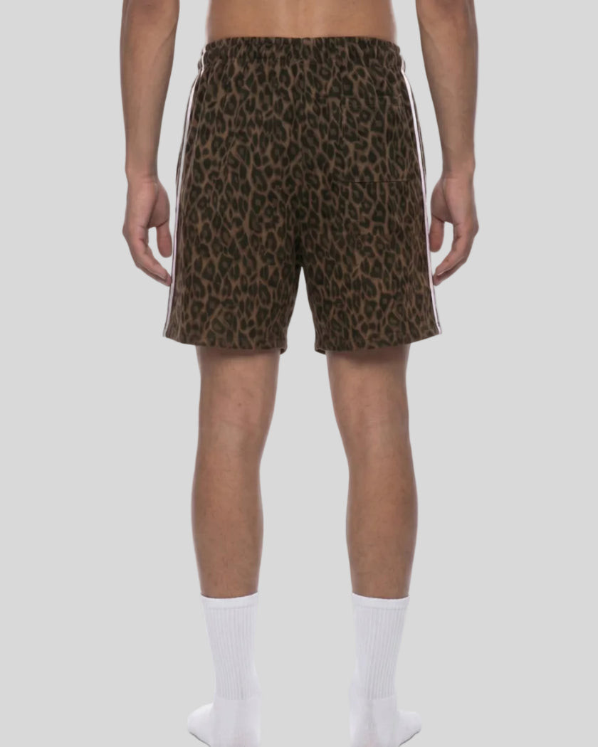 Lower body back view of woman wearing Leopard Accent Shorts with contrast white side stripes in Leopard Brown