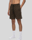 Lower body side angle view of woman wearing Leopard Accent Shorts in Leopard Brown