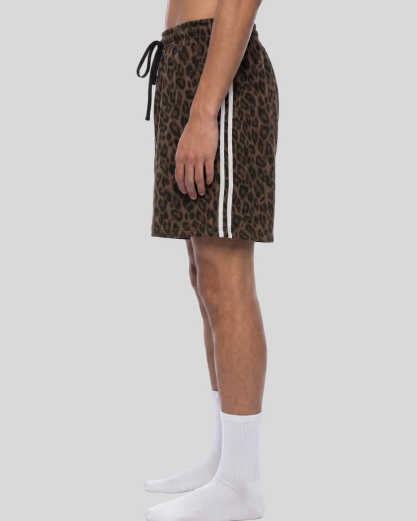 Lower body side view of woman wearing Leopard Accent Shorts with contrast white side stripes in Leopard Brown