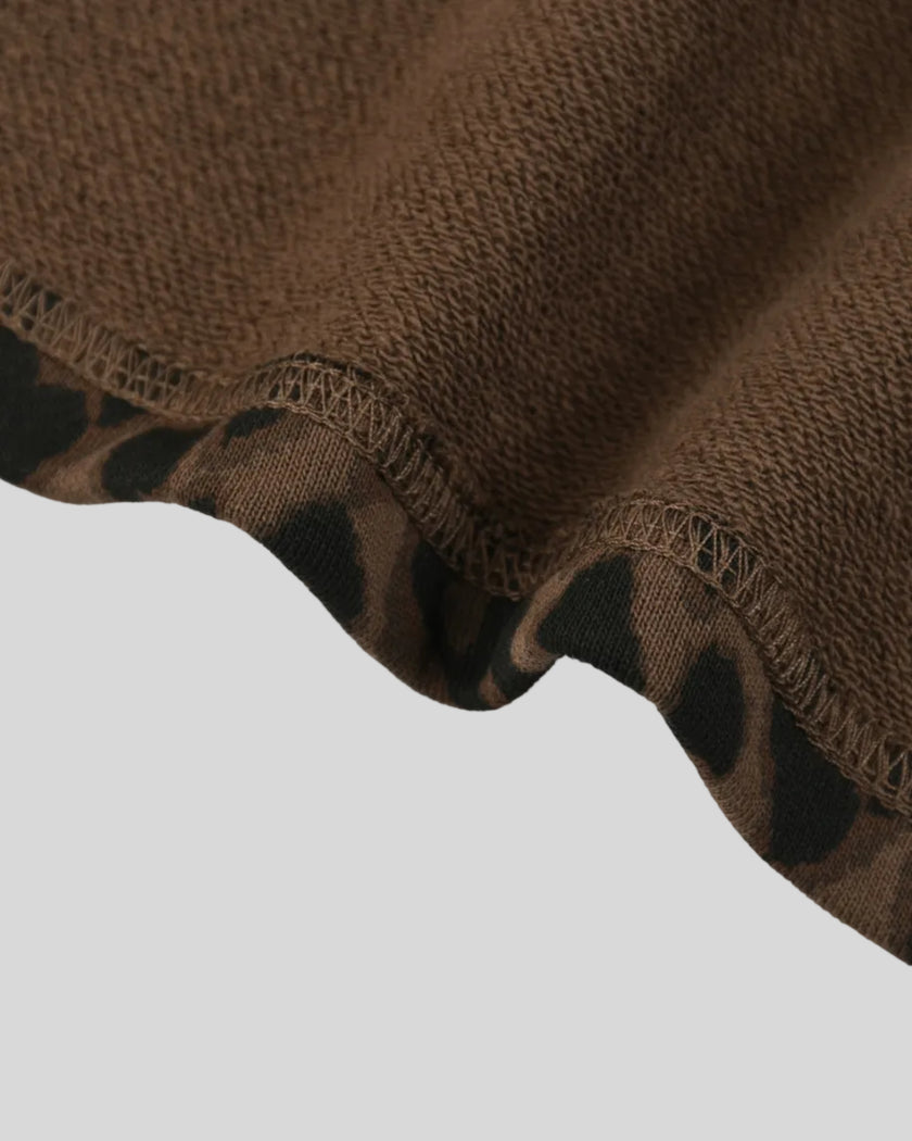 Closeup of straight leg hem and leopard print on Leopard Accent Shorts