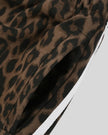 Closeup of functional side pocket and contrast white stripes on Leopard Accent Shorts