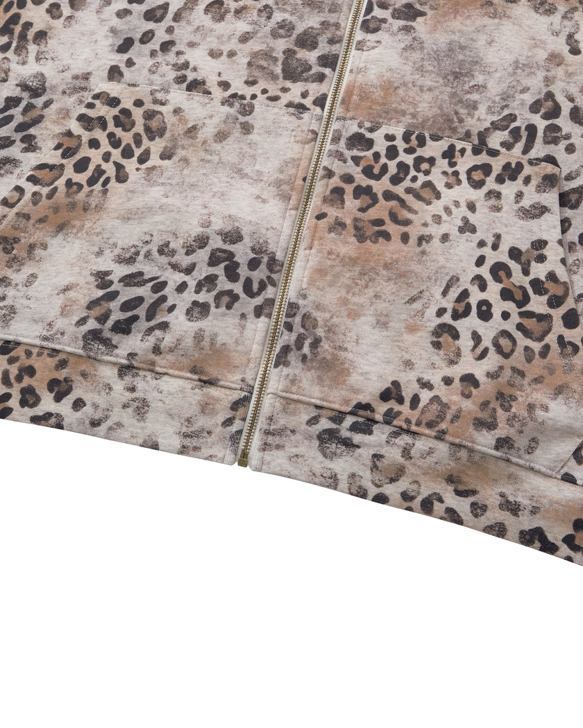 Closeup of front pockets, zipper and ribbed hem on Leopard Vintage Accent Hoodie
