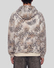 Upper body back view of man wearing Leopard Vintage Accent Hoodie with oversized hood in Leopard Dark Gray