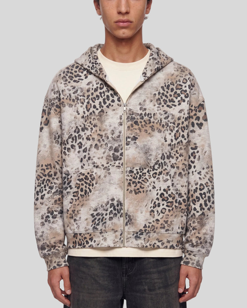 Upper body front view of man wearing Leopard Vintage Accent Hoodie zipped closed in Leopard Apricot